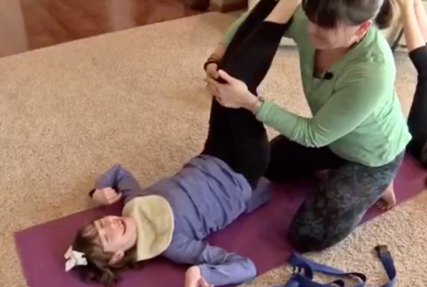 Meghan with a Yoga client